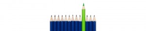 picture of 10 blue pencils with one green pencil in the middle pushed forward